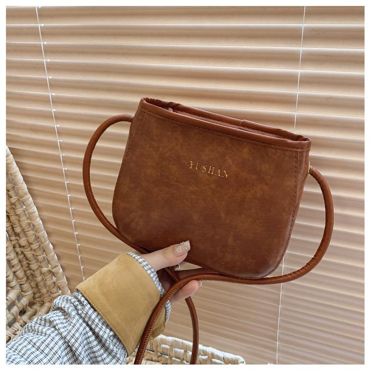 

Casual women s summer new fashionable large-capacity casual solid color retro shoulder crossbody bucket bag коричневый