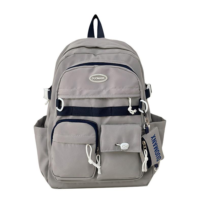 Simple solid color casual backpack high value junior high school student schoolbag large capacity versatile tooling backpack