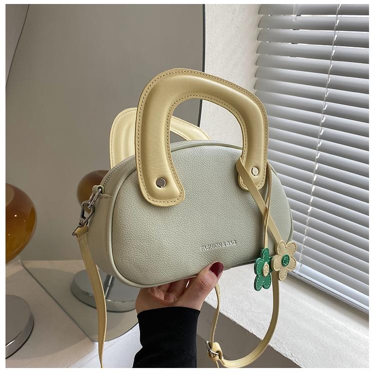 

Crossbody small bag Internet celebrity women s bag 2025 summer simple new niche premium design portable shoulder small round bag
