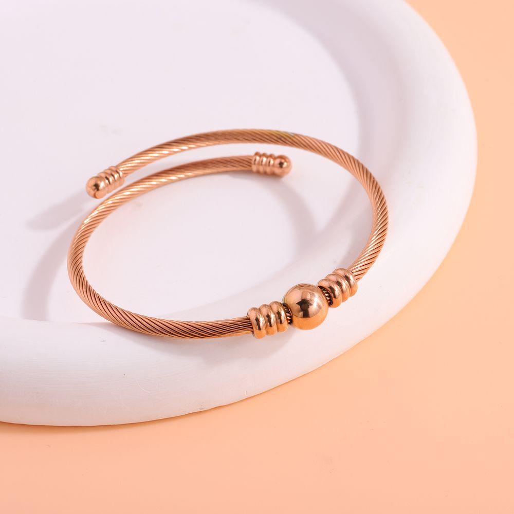 Simple design steel wire opening , fashionable, European and American versatile, send girlfriends round beads, do not fade titanium steel