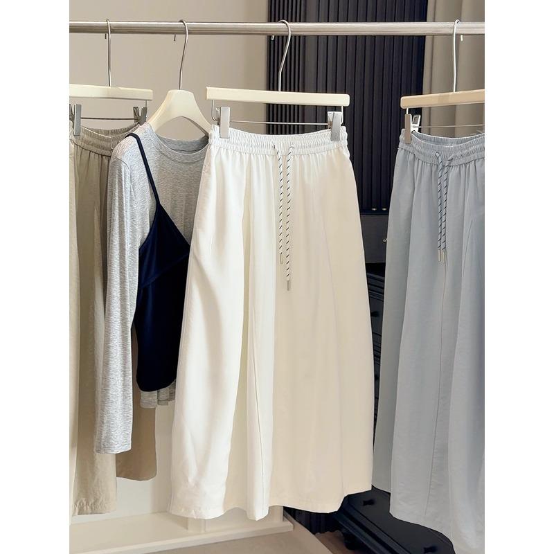 Solid color high waist fashion simple pumpkin skirt women's spring new elastic waist drawstring medium and long thin bud skirt