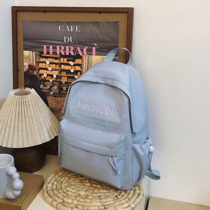 School bag Korean version ins style versatile junior high school student school bag solid color letter backpack high value simple lightweight backpack