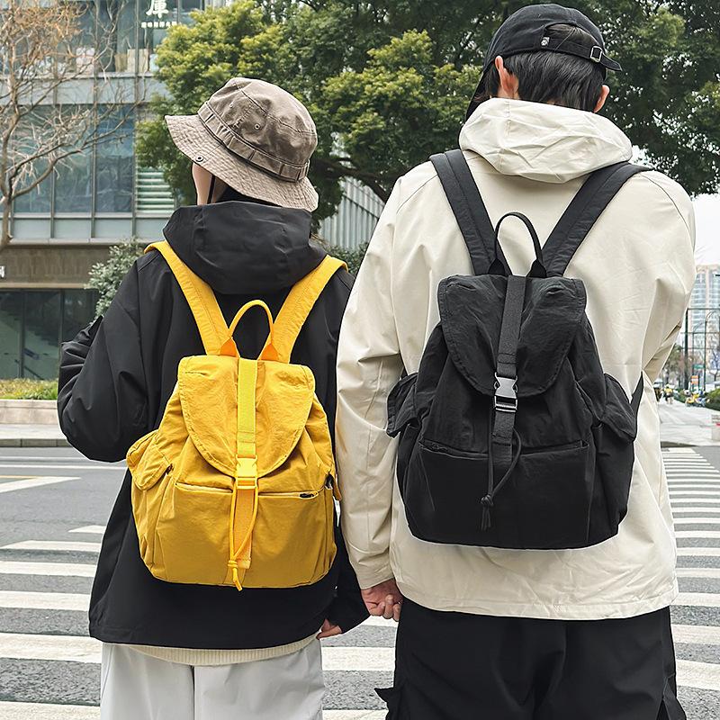 2025 spring new solid color college student backpack women's outdoor leisure large capacity simple high value backpack men