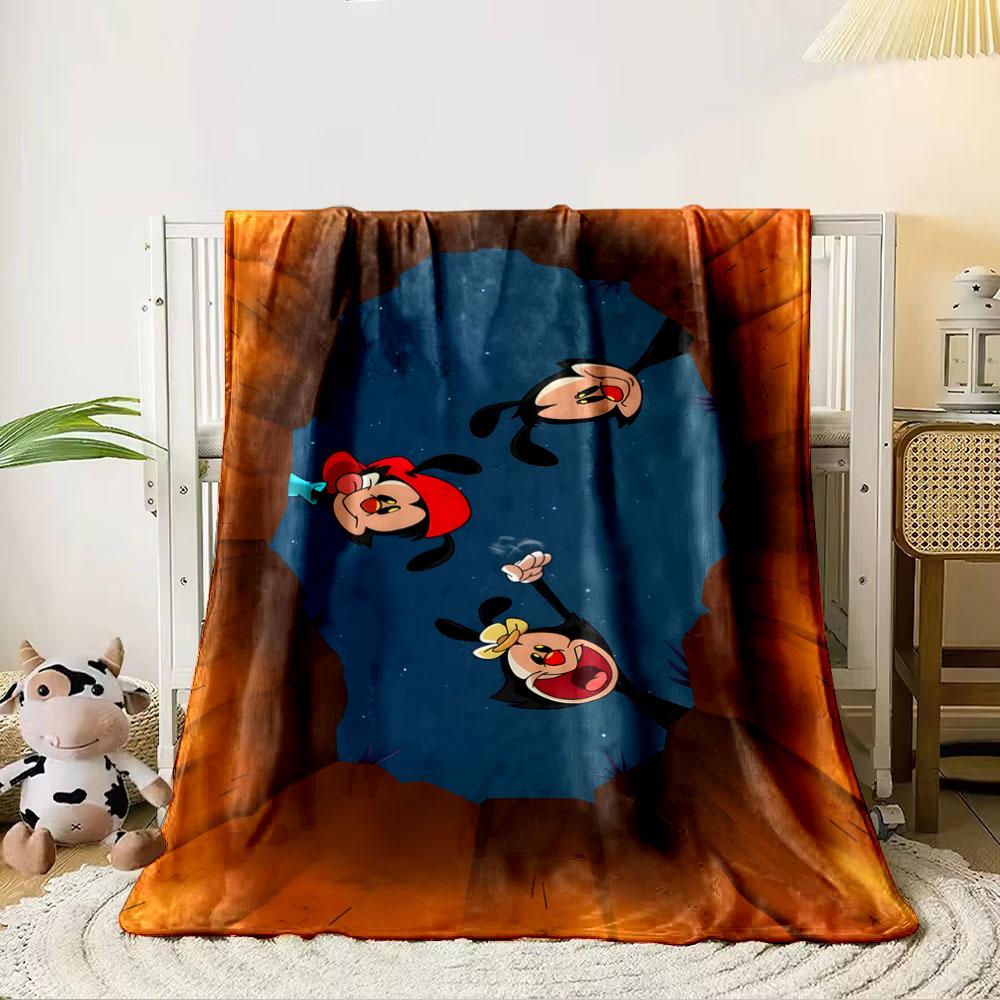 Three cartoon characters peer into a hole at night surrounded by rock walls. for all seasons blanket lunch break throw gift 80cm x 120cm