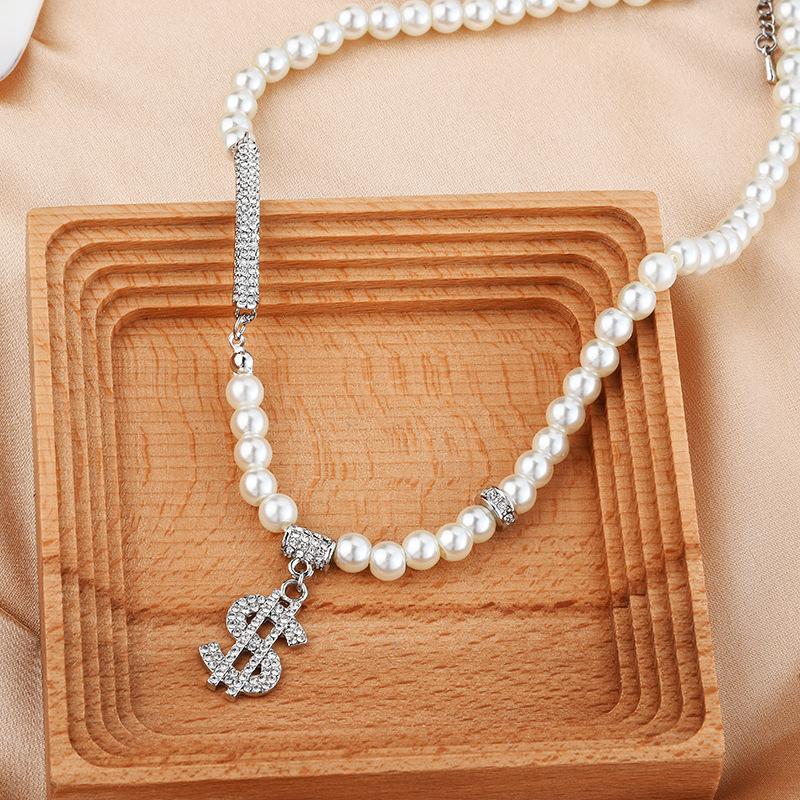 

Элегантное жемчужное ожерелье-цепочка с символом доллара, изготовленное из прочной титановой стали