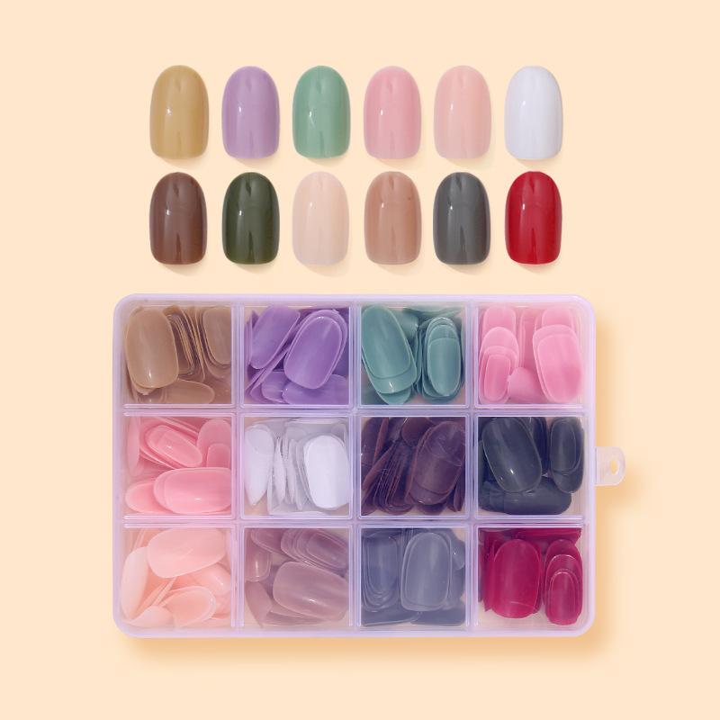 Enfärgad nagelbit Källa Nagellapp 12 färger i ask Glansig nagelbit 288 stycken