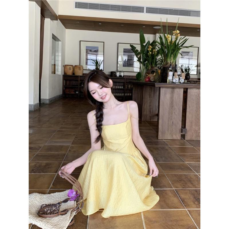 Small yellow suspender dress women's summer new waist temperament long dress seaside vacation skirt