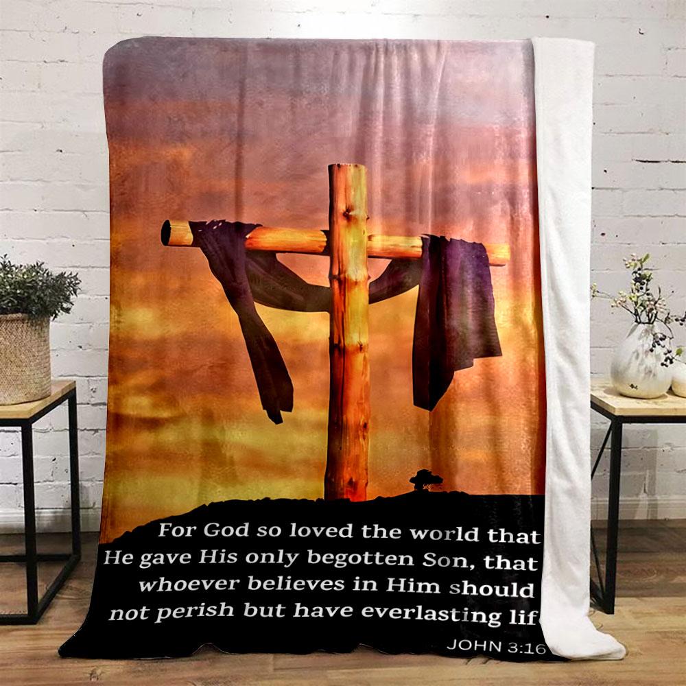 A wooden cross draped in cloth set against a vibrant sunset background. for all seasons blanket lunch break throw gift
