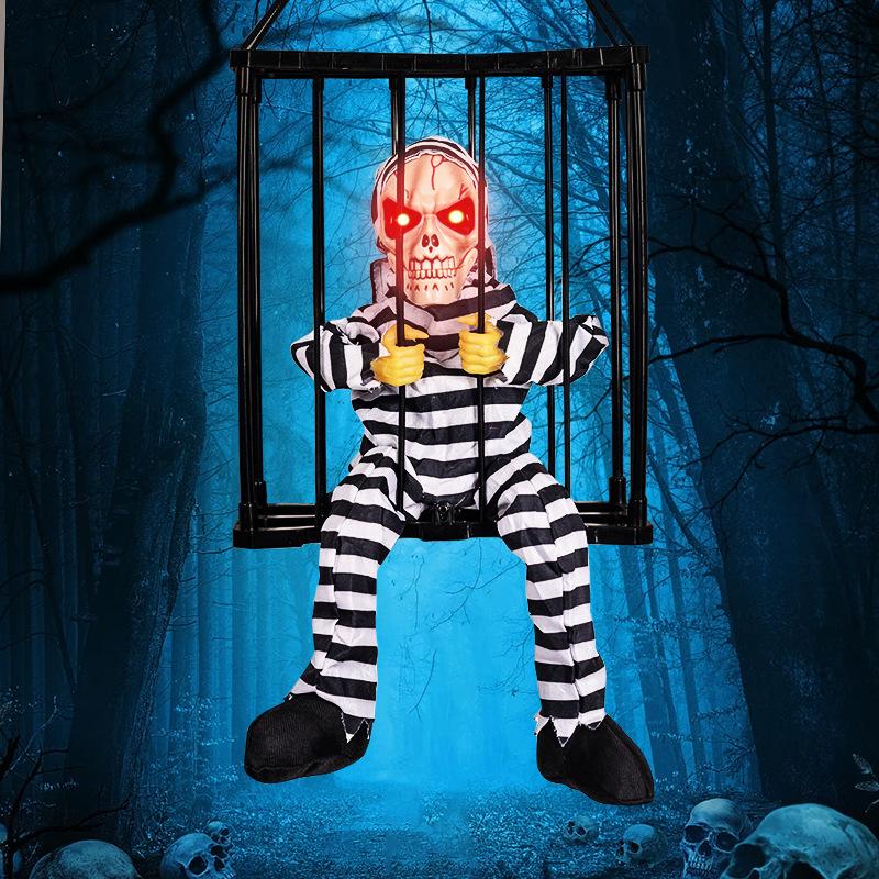 

1Pcs Electric Skeleton Toy Halloween Decoration Prisoner Ghost In Cage Scary Skull Prop Glowing Eye Sound Doll as the picture
