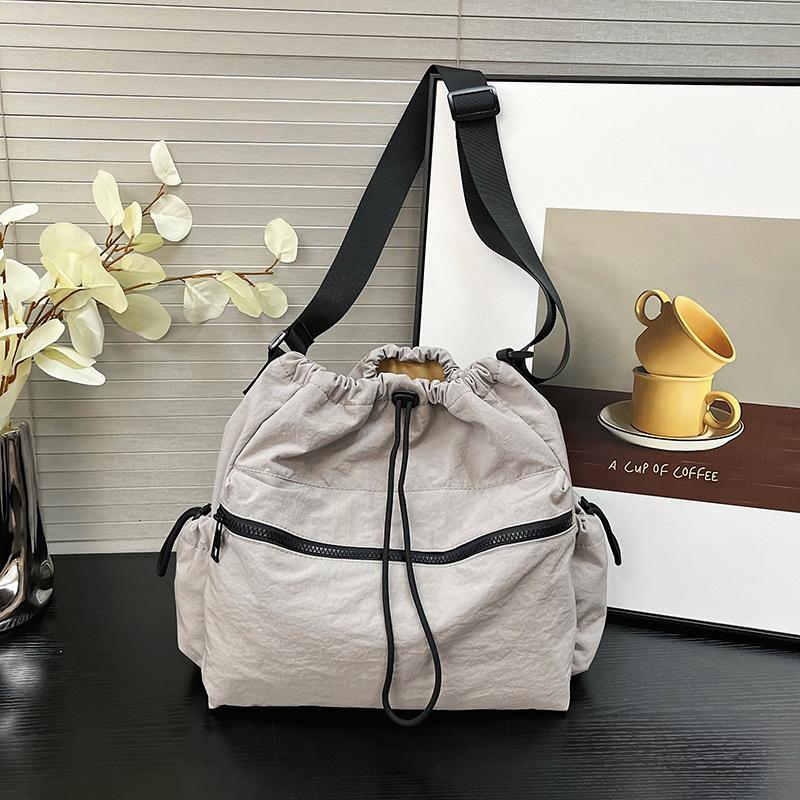 2025 new Japanese drawstring tote bag girls casual large-capacity niche design casual shoulder messenger bag