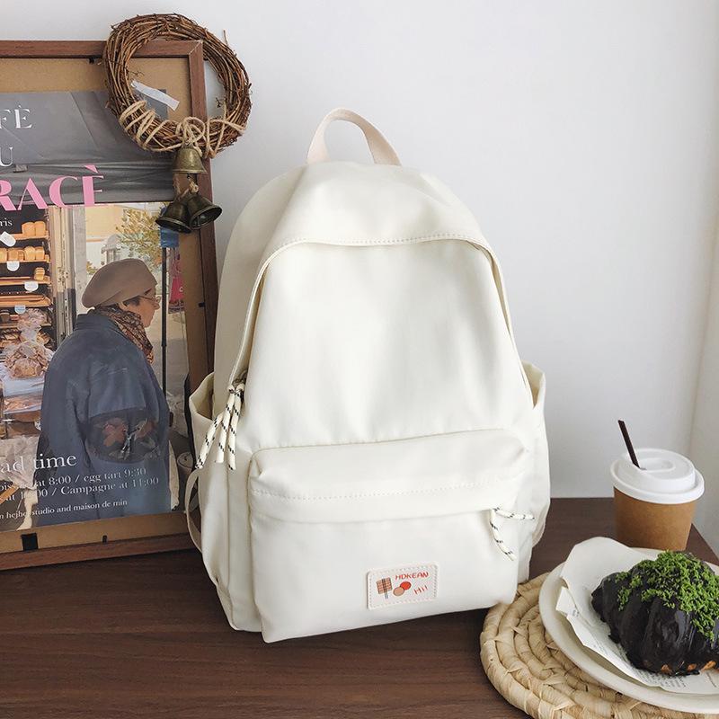 New casual simple solid color backpack large capacity junior high school student schoolbag