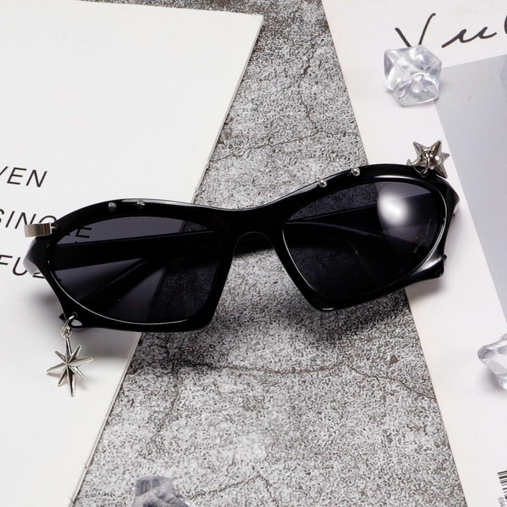 Trendy punk-style black sunglasses, unisex, with a unique cat-eye design, embellished with rhinestones, rivets, and a metal starburst pendant