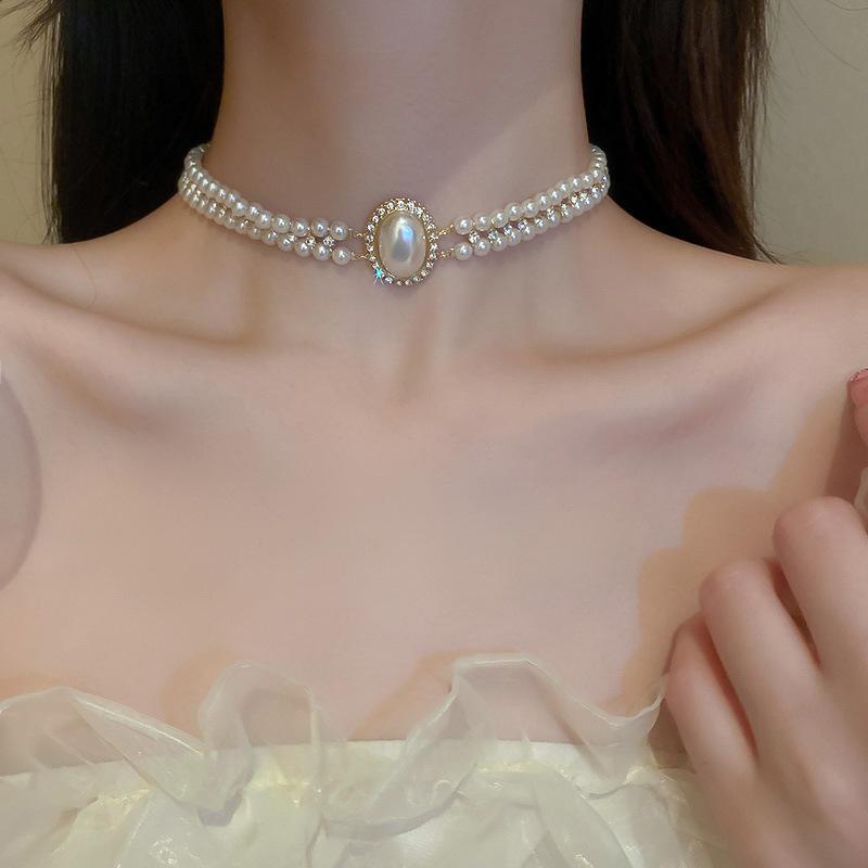 

Двухслойное колье в стиле барокко с овальными жемчужными заклепками и модным темпераментом, преувеличенное и универсальное колье в ретро-лесном стиле для женщин