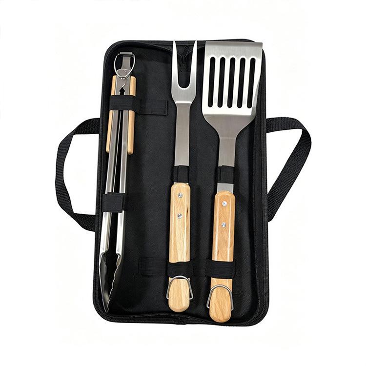 Premium Stainless Steel BBQ Tool Set with Wooden Handles - Includes Fork, Shovel, and Tongs for Outdoor Camping and Grilling.