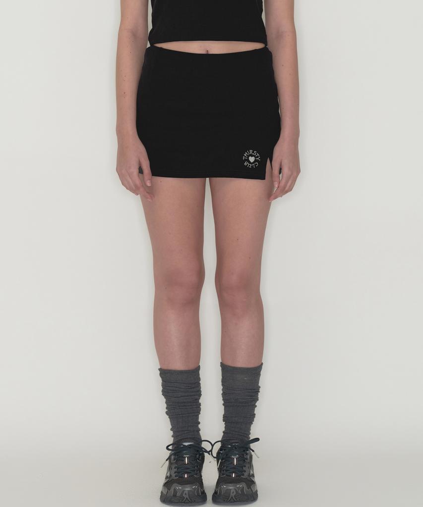 Tteolseutikeulleob Round Logo Slit Skirt Pants - Black