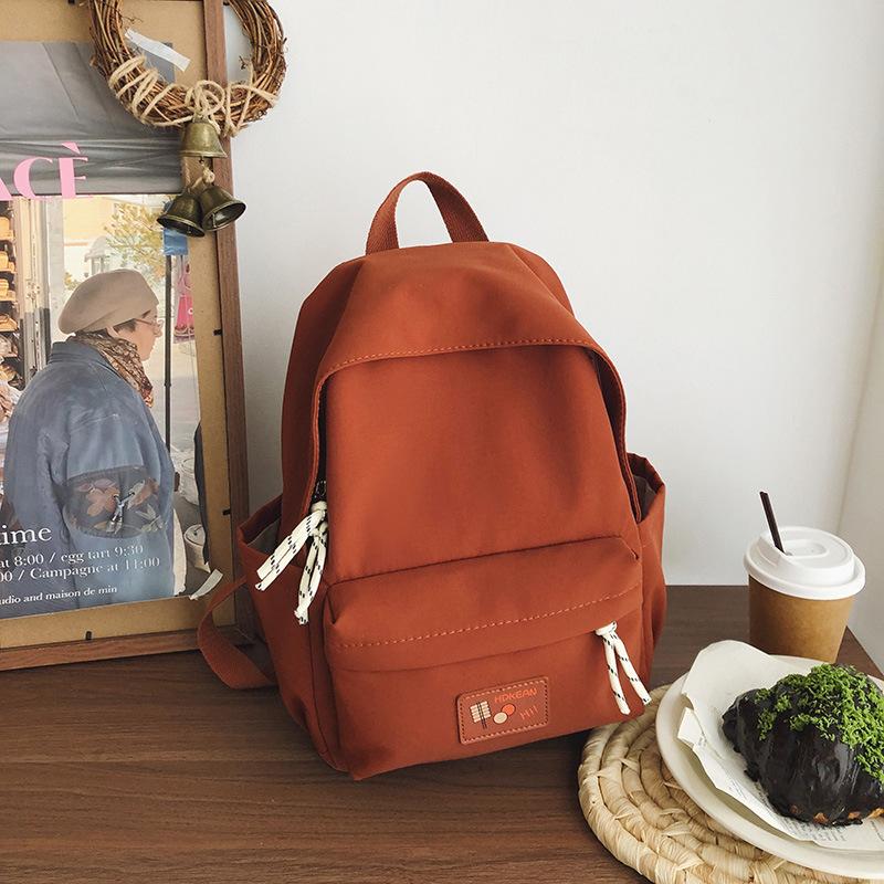 New casual simple solid color backpack large capacity junior high school student schoolbag