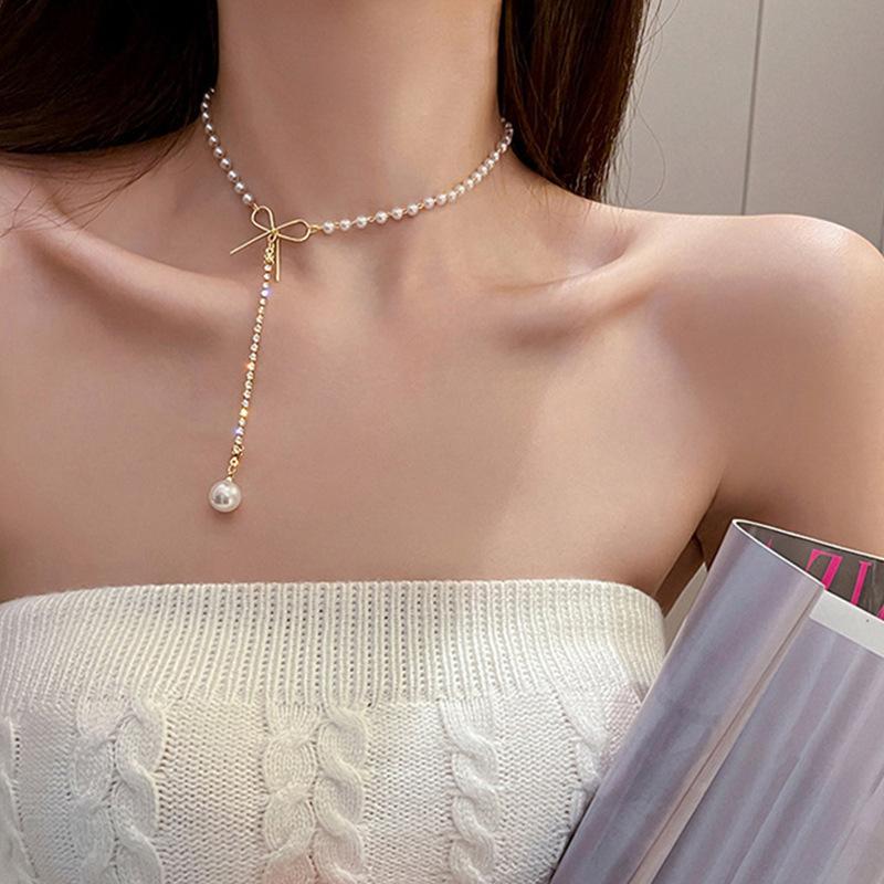 Japan and Korea bow pearl necklace women's pendant light luxury niche design sense new fairy collarbone chain