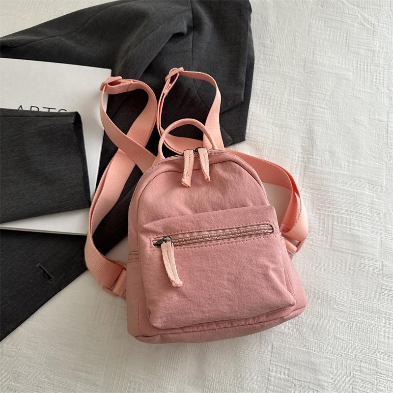 Einfacher lässiger Mini-Rucksack für Damen 2025 neue modische einfarbige kleine Tasche klein frisch Studenten-Reiserucksack