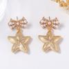 European and American Ocean Leisure Vacation Style Alloy Imitation Pearl Bow Five-pointed Star Earrings Versatile Women's Earrings