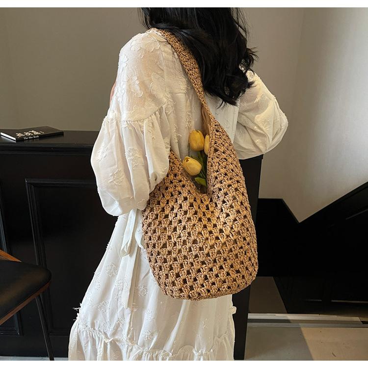 Neue hohle Stroh-Tragetasche Damen Strandurlaubsstil Lässige Schulter-Strandtasche Große Kapazität Stroh gewebte Tragetasche