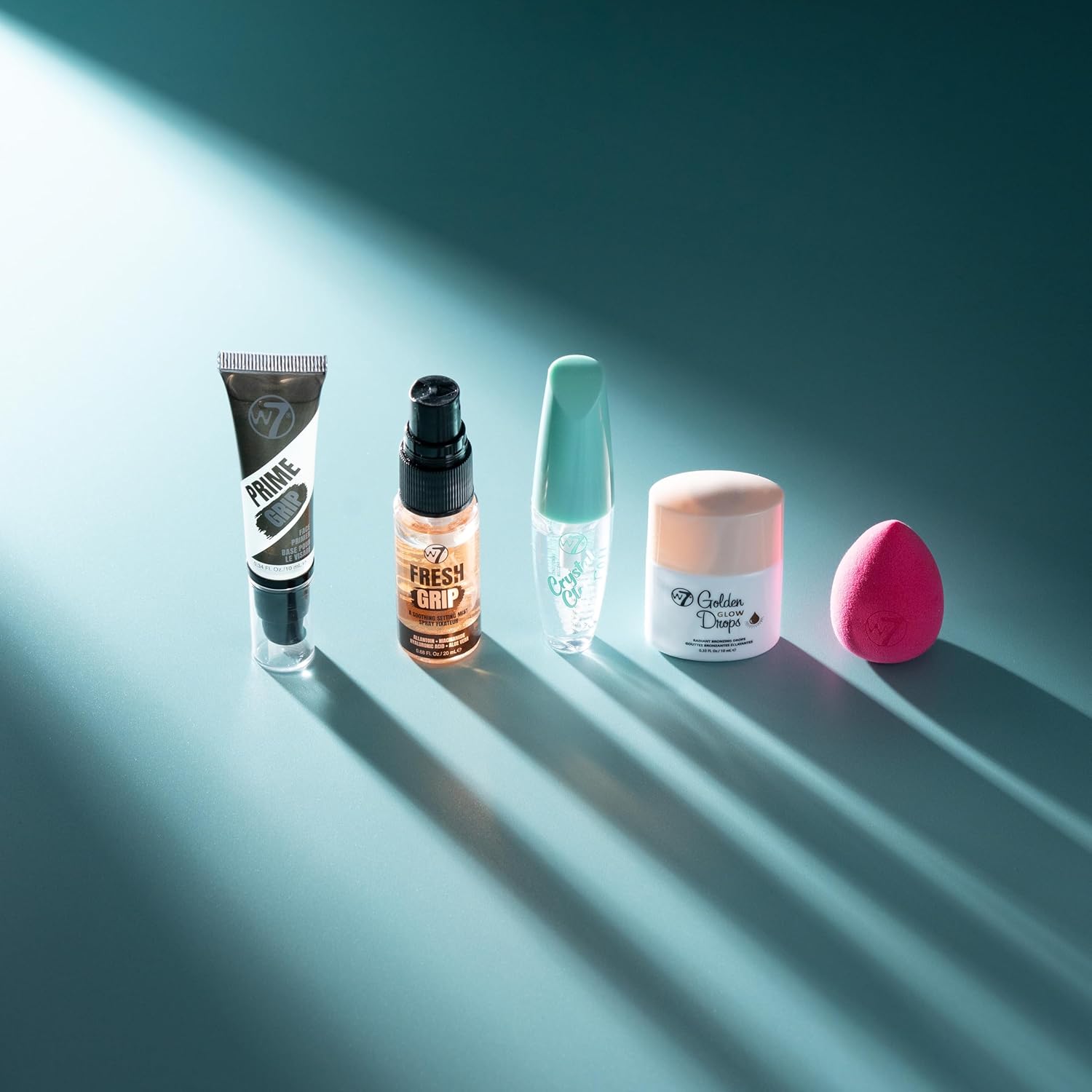 W7 On the Go Essentials Gift Set - Mini Makeup Must-Haves with Primer, Setting Spray, Mascara, Golden Glow Bronzing Drops & Beauty Sponge - Travel or