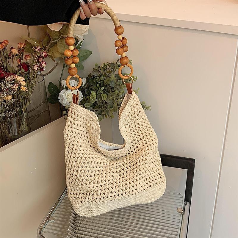 Lässige Baumwollfaden-Flechtbeutel mit großem Fassungsvermögen, neue hohle handgewebte Schultertasche, Urlaubs-Strandtasche, vielseitige Damentasche