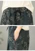 Pantaloni a zampa crop in denim jacquard floreale taglie forti