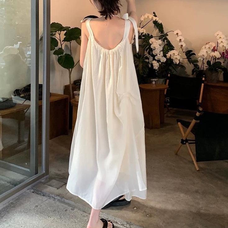 Fashion beige gentle wind lace-up suspender dress women's summer lined sweet loose backless A-shaped long dress