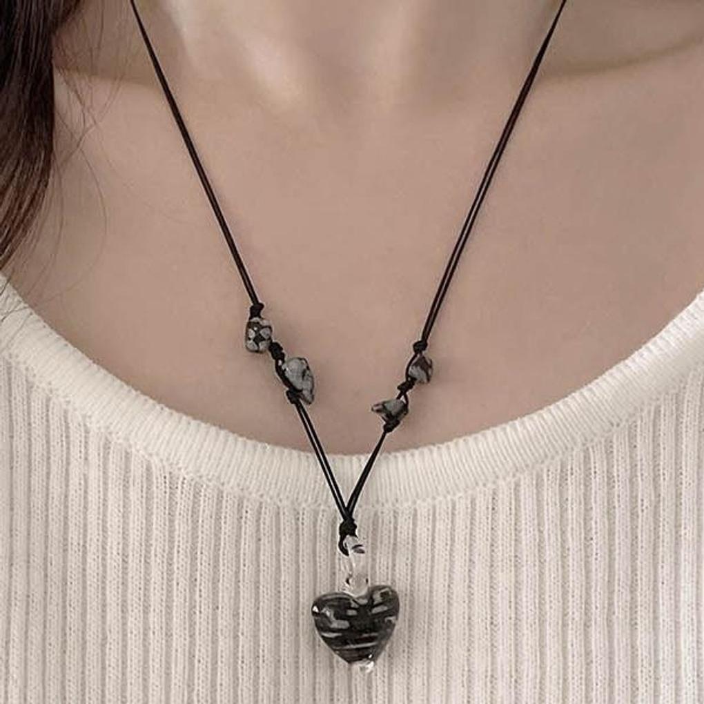 Vintage achromatic knotted glass heart necklace