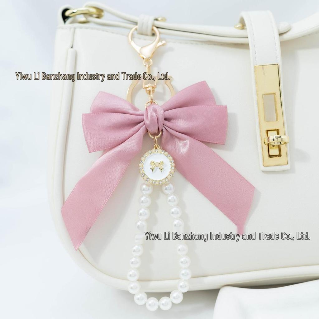 Large Bow Faux Pearl Bracelet Keychain with Colored Woven Strap and Alloy Tag Pendant