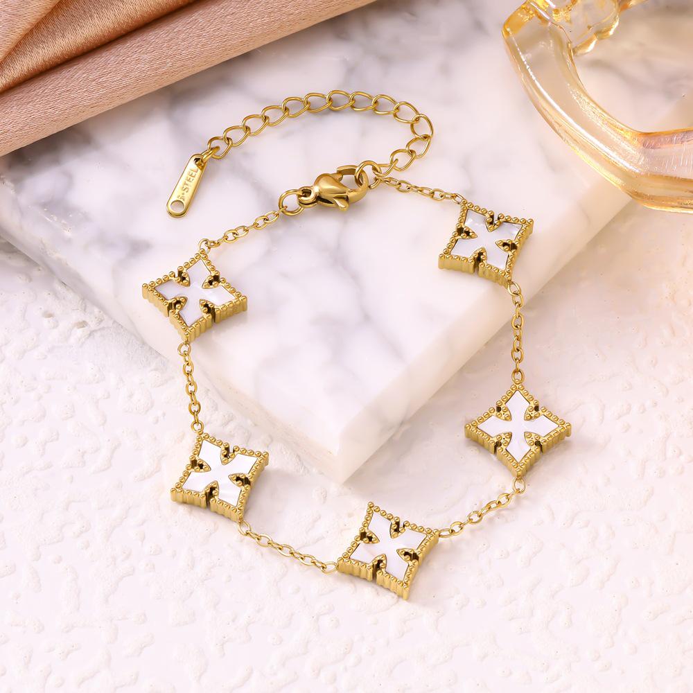 

Stylish Titanium Steel Four-Leaf Clover & Five-Petal Mother-of-Pearl Bracelet for Women, Inspired by Online Trends