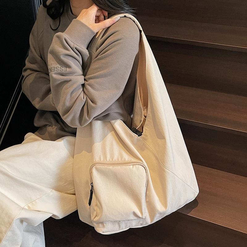 

Japanese simple handbag bag women s 2025 new large-capacity triangle bag casual shoulder bag commuter canvas tote bag 44*16*30