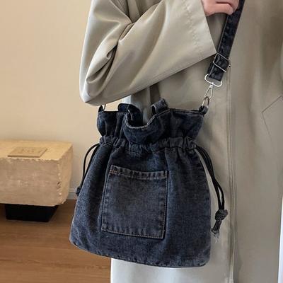 Bolsa jeans feminina 2025 nova bolsa de cordão estilo literário bolsa tipo balde simples e versátil bolsa de ombro transversal