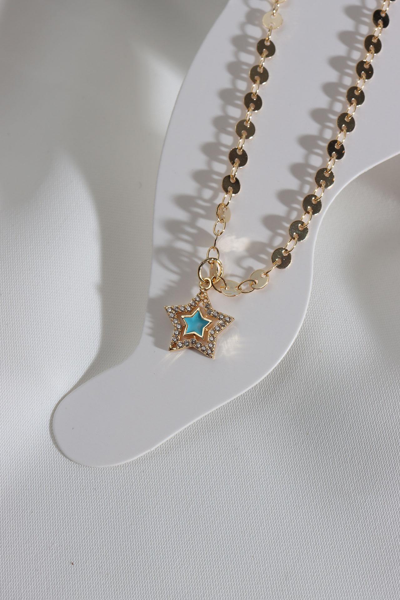 

Ножной браслет золотого цвета с синей эмалью и звездами