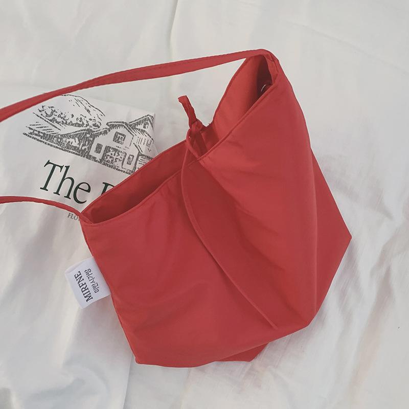 Casual large-capacity bag women's 2025 simple canvas bag versatile one-shoulder armpit bag student class bag handheld