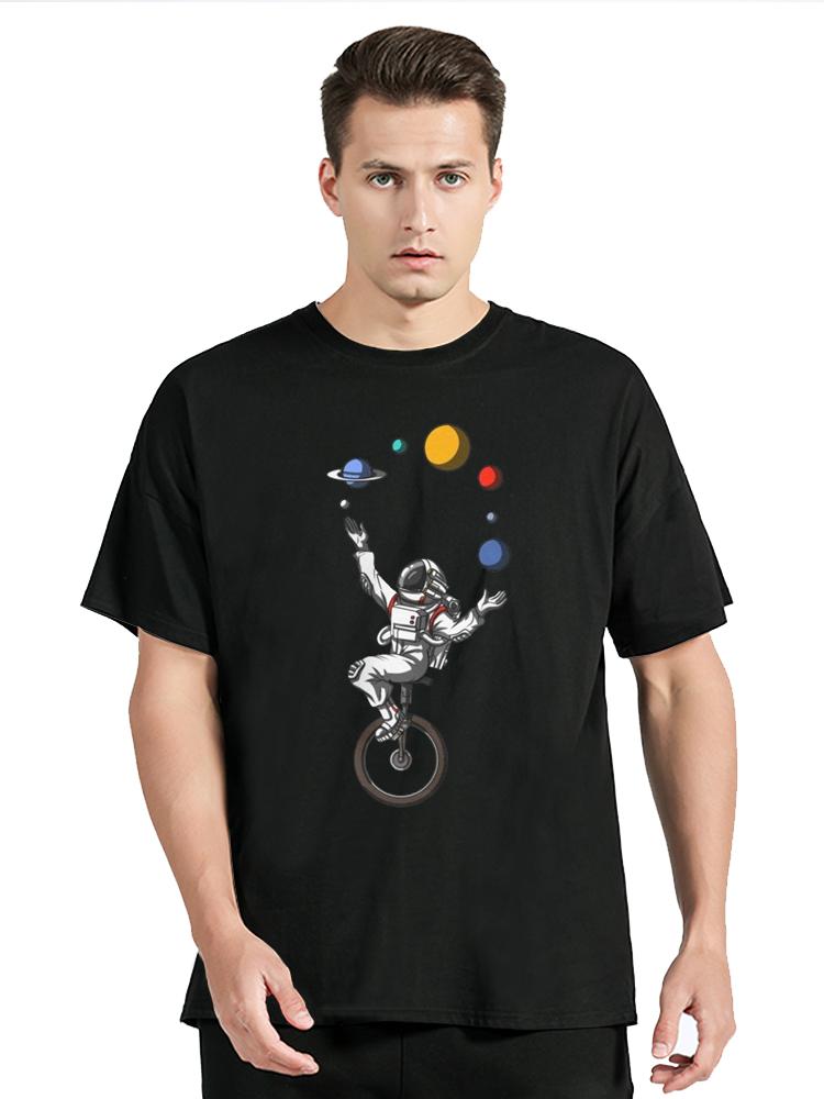 Space Astronaut Riding Bicycle Juggling Solar System Planets Funny Cotton T-Shirt Men's Clothin