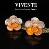 New Chinese Cat's Eye Stone Flower Stud Earrings - Gold-Plated Copper, Three-Dimensional Floral Retro Design