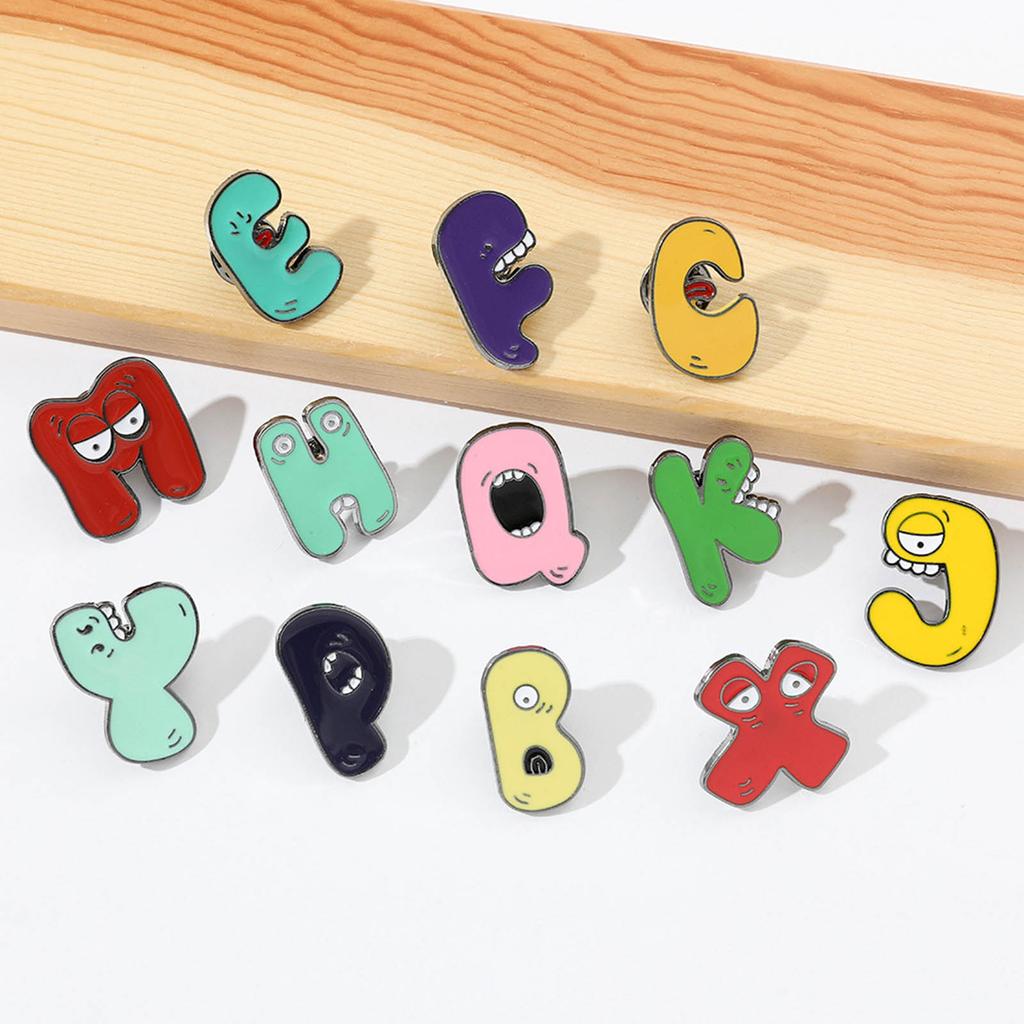 26Pcs Alphabets Enamel Pins Cartoon Letter Legend Brooch Metal Lapel Pins Hat School Bag Badges Jewelry Accessory Gift