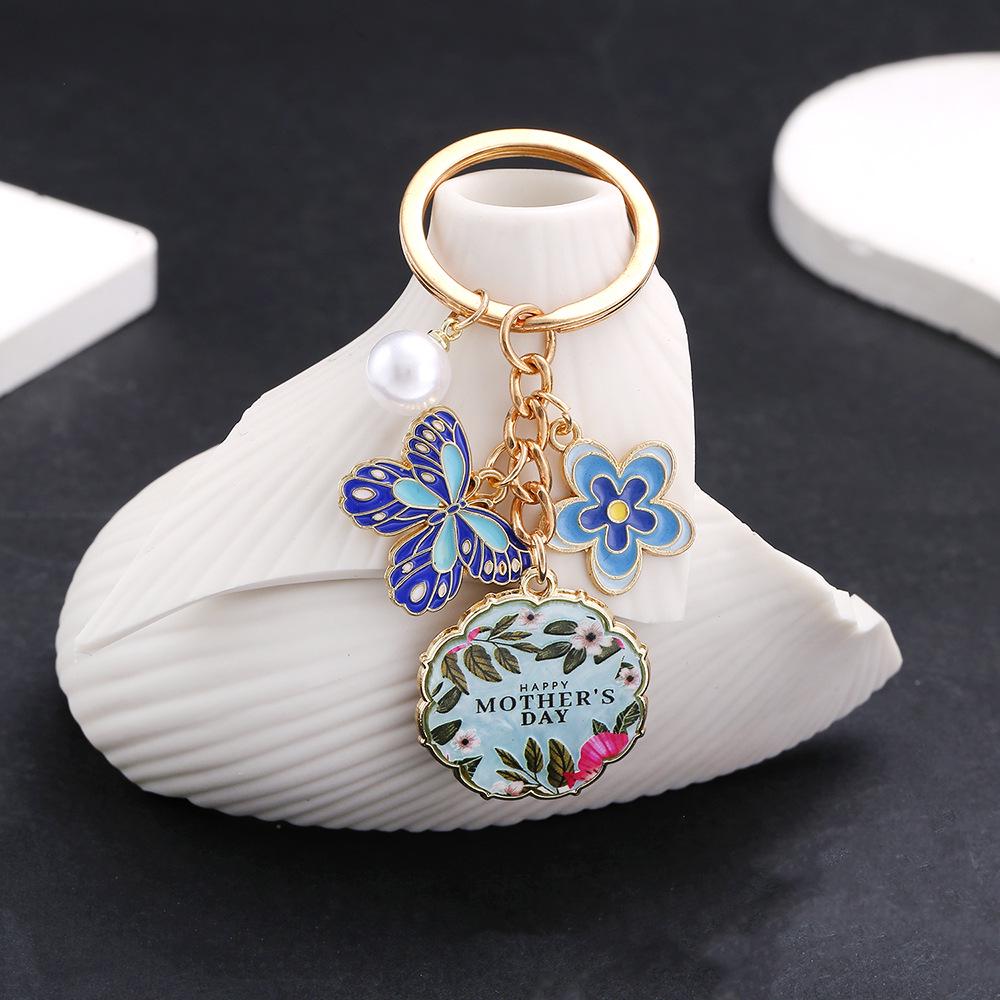 Blue Butterfly Flower Pendant: Mother s Day Drip Oil Keychain with Pearls and Hanging Ornament.