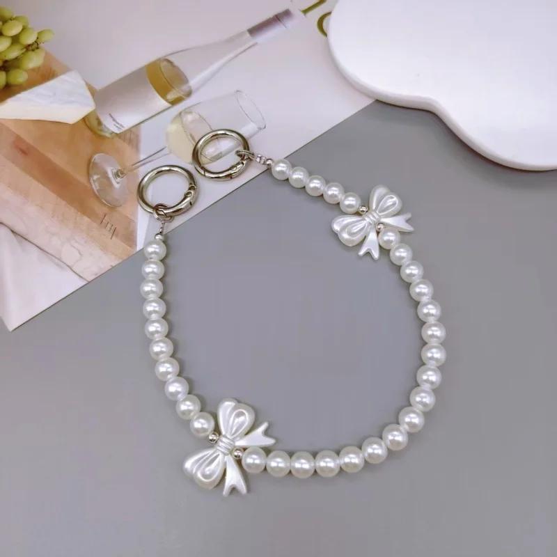 

Elegant Phone Chain with Pearl Beads, Butterfly Knot Pendant, Wrist Strap for Mobile Phones, High-End Style Accessory белый