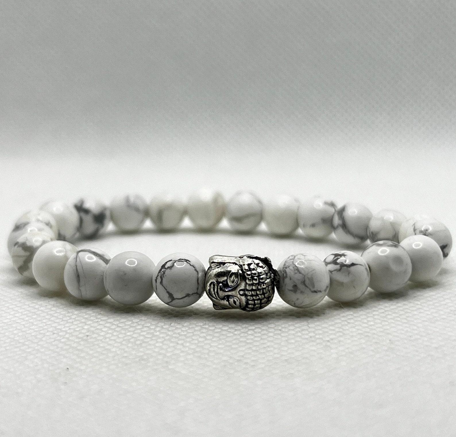 

Elegant White 8mm Howlite Beaded Bracelet with Silver Buddha Pendant Charm, Stylish Spiritual Accessory for Calm & Balance, Unique Gift Idea білий/сірий