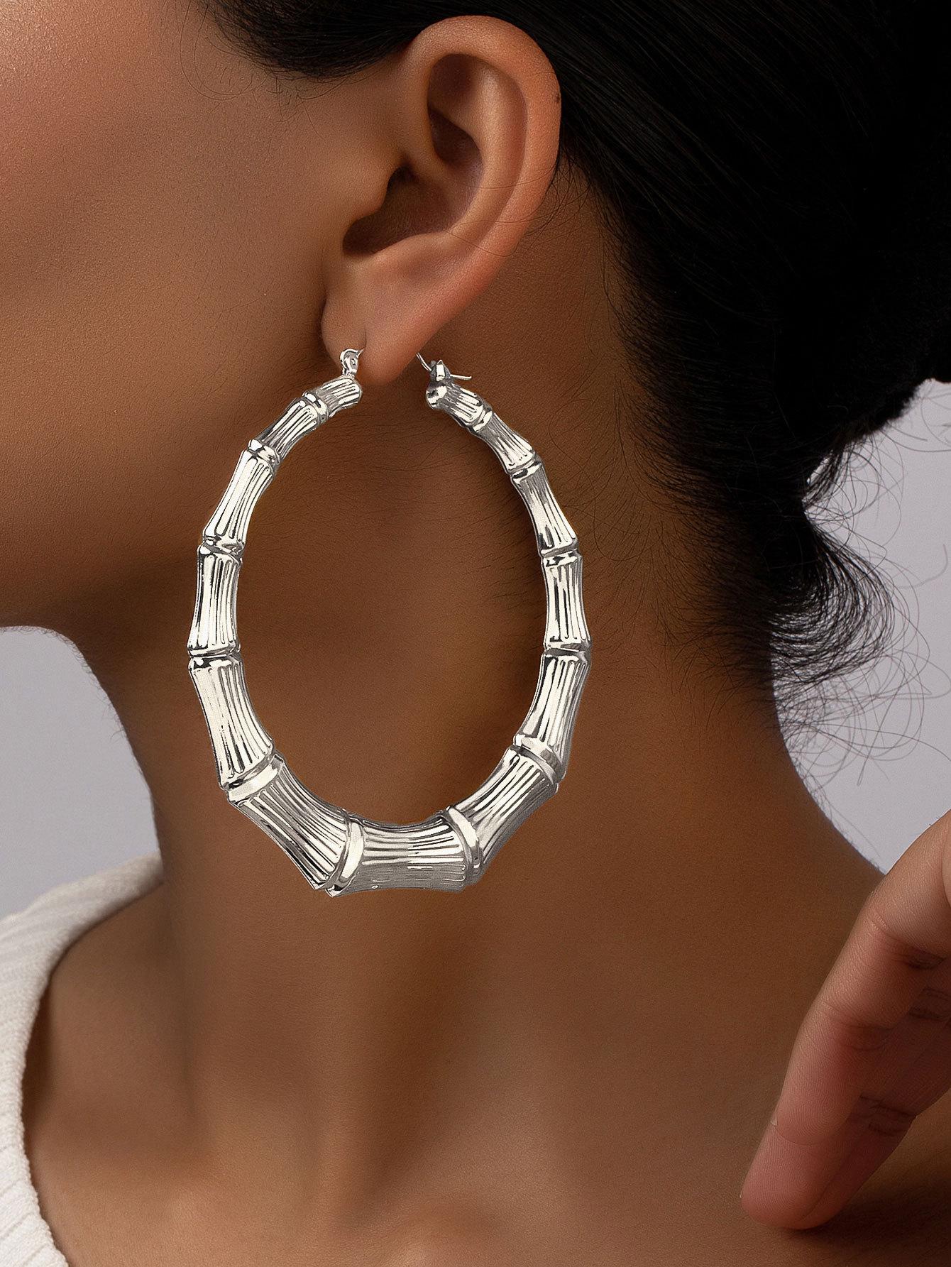 

Extra-Large Gold Bamboo Hoops: Bold European & American Style Earrings for Hiphop, Street Dance, and Nightclub Fashion.