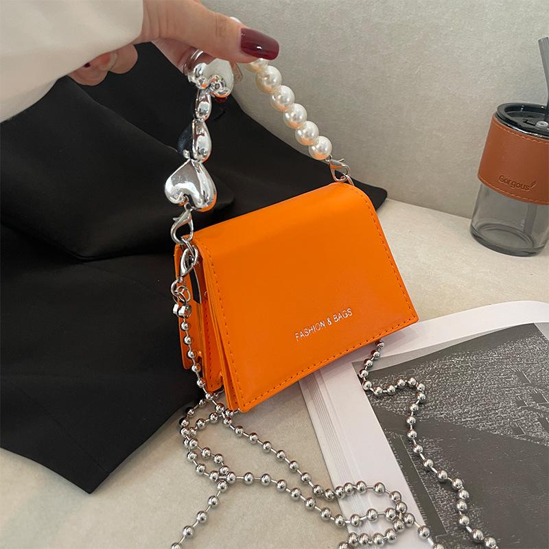 

This year s popular bag new 2025 small fragrance pearl handbag women s shoulder crossbody chain small square bag pu помаранчевий