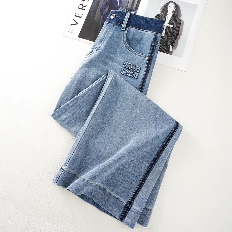 Damskie dżinsy z wysokim stanem i szerokimi nogawkami, pochlebny fason dla figury w kształcie gruszki - popularny styl do ziemi na wiosnę i jesień 2025