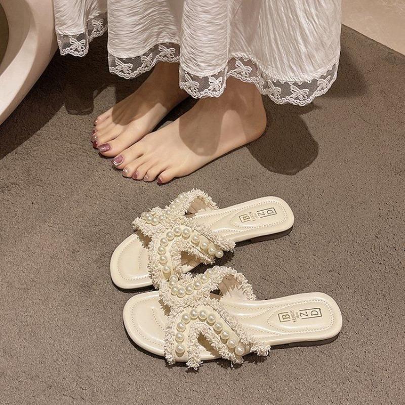 Flat-bottomed slippers women wear spring soft-bottomed fairy versatile pearl beach sandals summer new models
