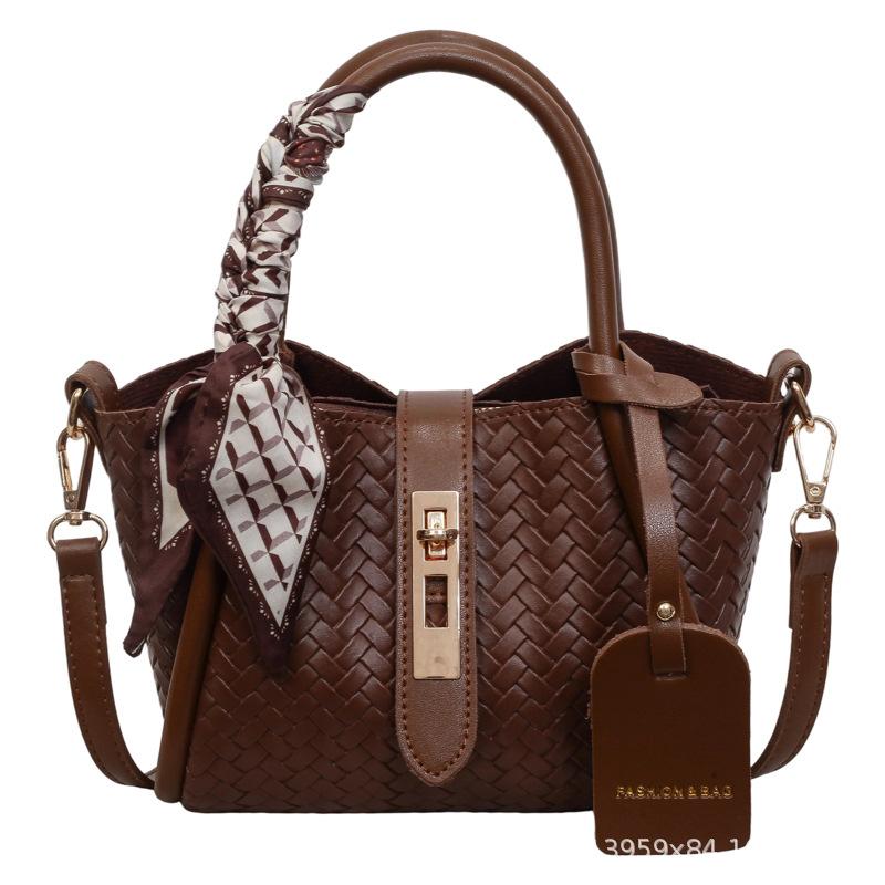 Niche lock woven pattern portable bucket bag new fashion versatile large capacity shoulder messenger bag women