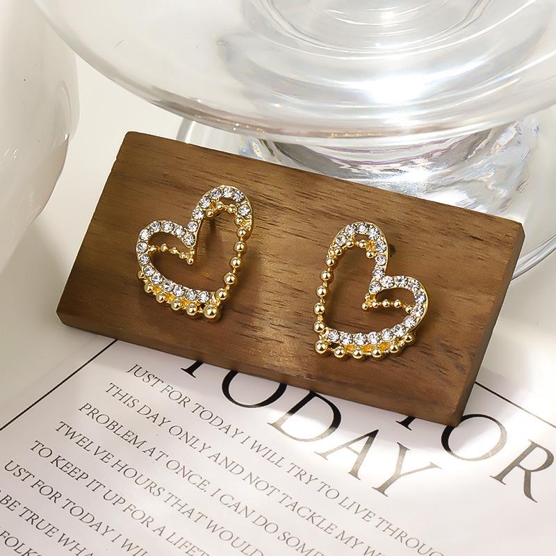 

Корейские модные серьги с жемчугом и стразами в виде сердца и банта - Элегантные и универсальные