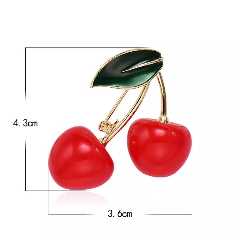 Luxuriöse rote Kirschbrosche für Damen: Elegantes Pullover-, Mantel- und Blazer-Pin-Accessoire