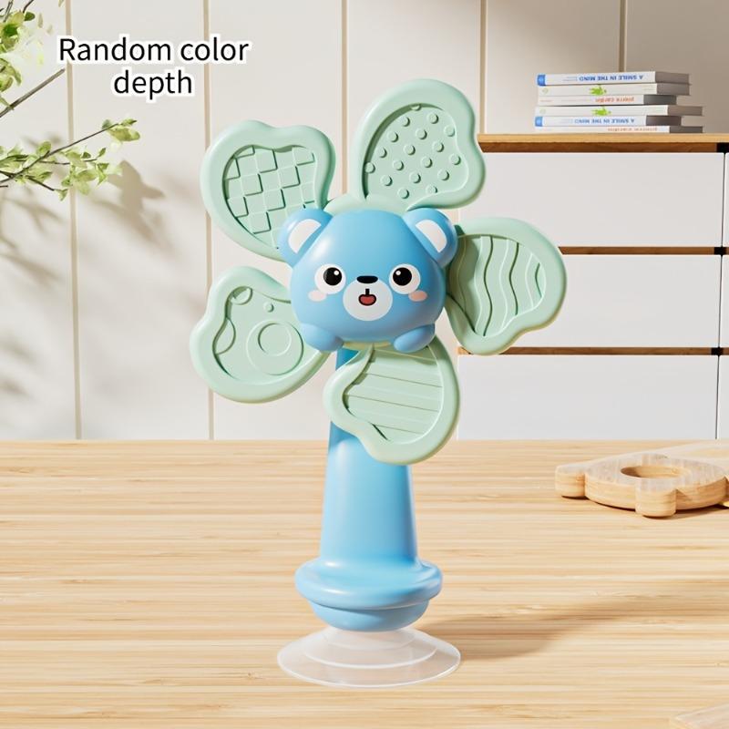 Baby Suction Cup Spinner, ABS sensory toy, portable for travel, helps develop motor and cognitive skills.
