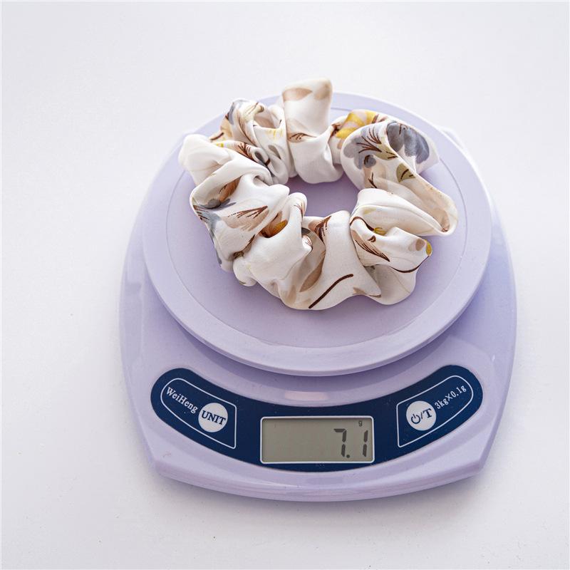 French-style smooth satin scrunchie with floral pattern, versatile elastic hair tie for women, popular on Instagram
